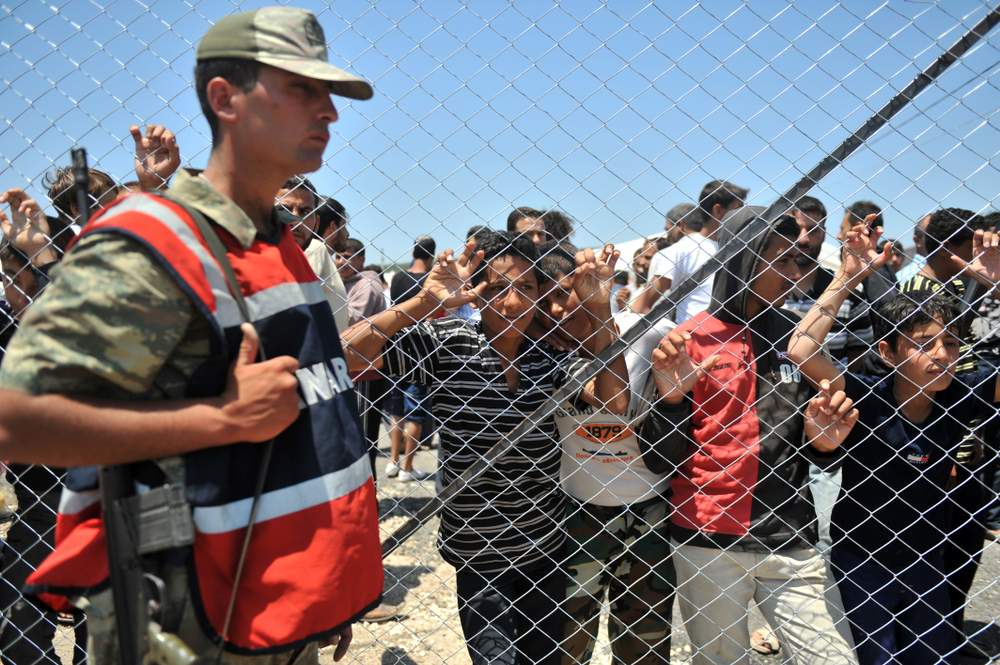 <i>Syrians in a refugee camp on the Syrian/Turkish border in 2011</i>