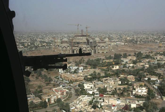 A US helicopter flies over Baghdad on its way to Camp Victory in March 2006.Photo by Ali Jasim\/Reuters